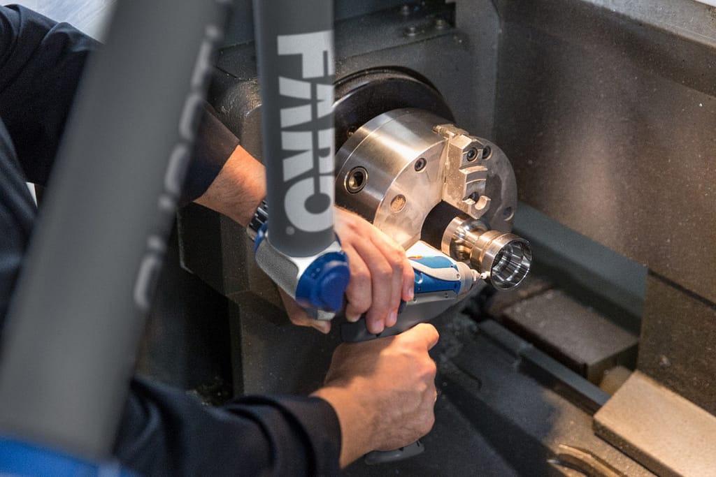 A close-up of a person working on a machine