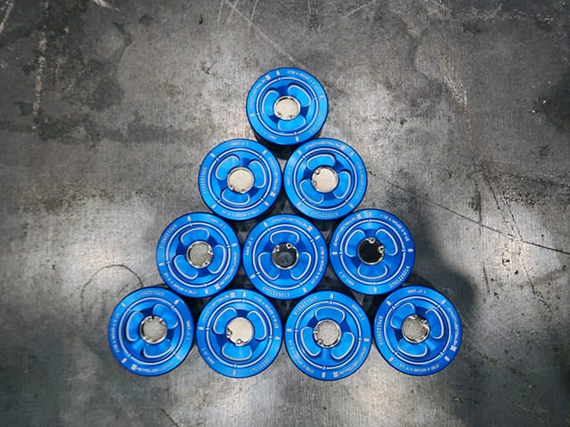 A pyramid of blue batteries on a concrete surface in Concord, Ontario